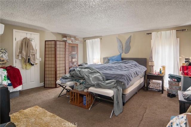 carpeted bedroom featuring a textured ceiling