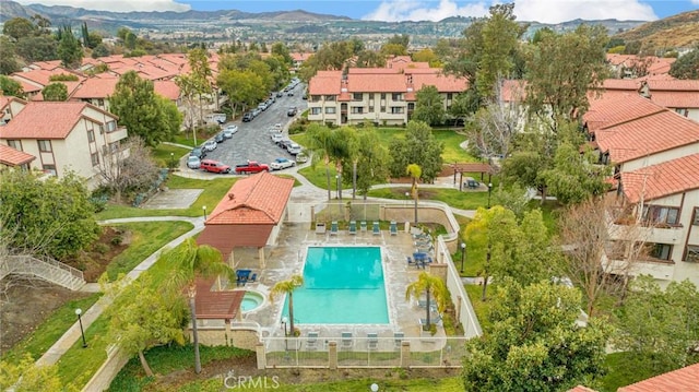 aerial view featuring a mountain view and a residential view