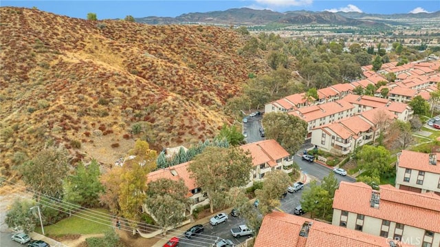 drone / aerial view with a residential view and a mountain view