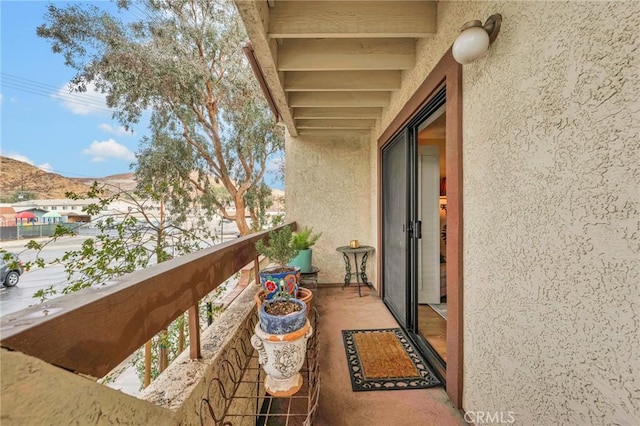 balcony featuring a mountain view