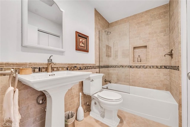 28010 Tiffany Ln Unit 309, Canyon Country, CA 91387 - bathroom with tile walls, toilet, tile patterned flooring, shower / bathtub combination, and wainscoting