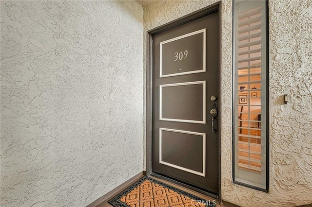 28010 Tiffany Ln Unit 309, Canyon Country, CA 91387 - doorway to property with stucco siding