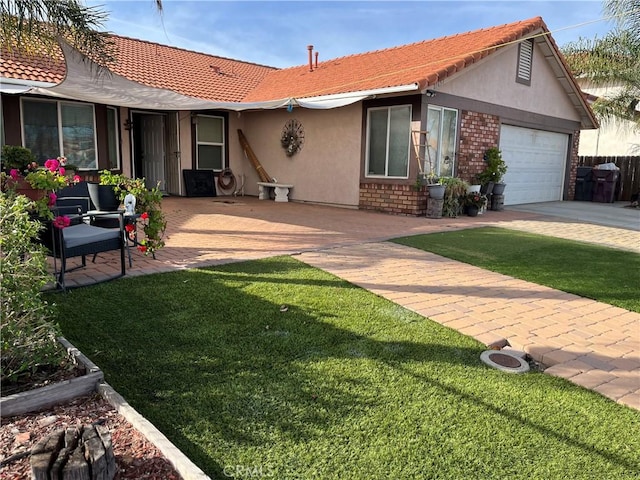 view of front facade with a front yard and a garage