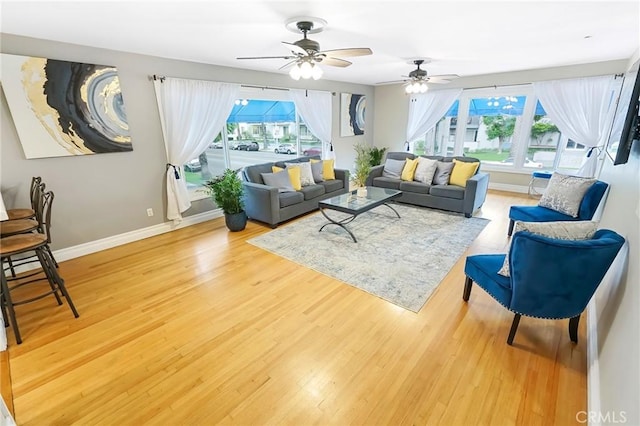 living room with hardwood / wood-style flooring and a wealth of natural light