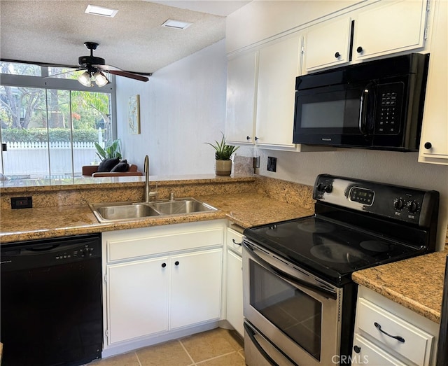 kitchen featuring light tile patterned floors, sink, a textured ceiling, black appliances, and white cabinets