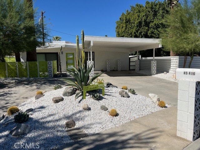 view of front of house featuring a carport