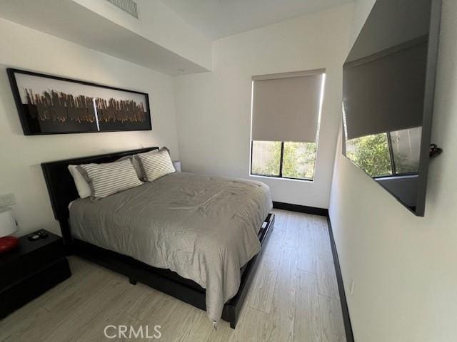 bedroom featuring light wood-type flooring