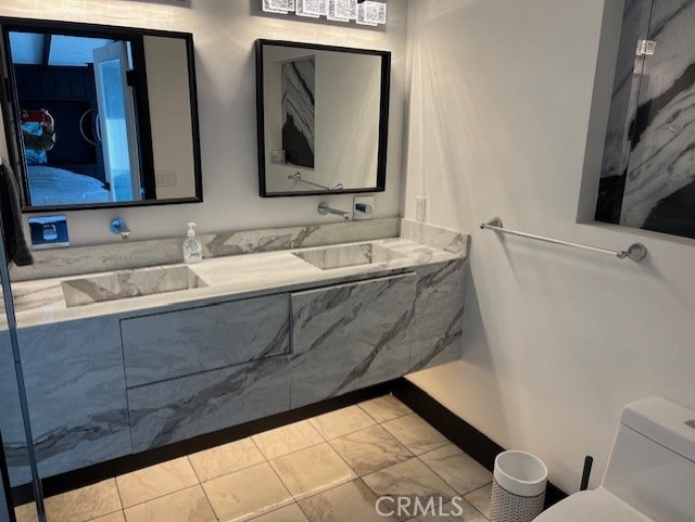 bathroom featuring sink and toilet