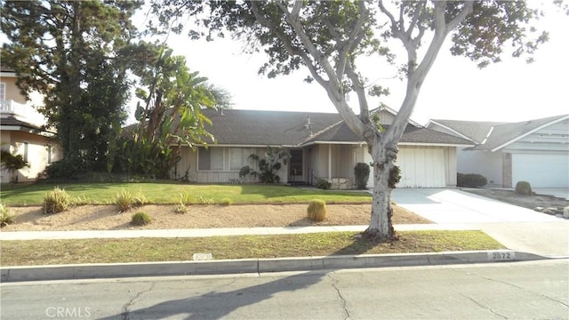 single story home with a garage and a front yard