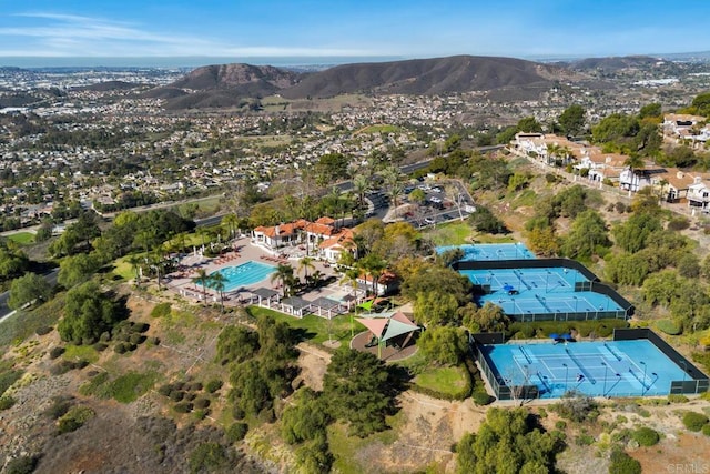 birds eye view of property with a mountain view