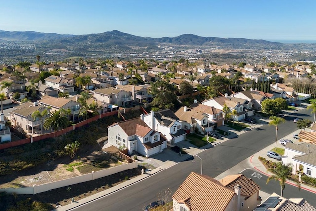 birds eye view of property with a mountain view and a residential view