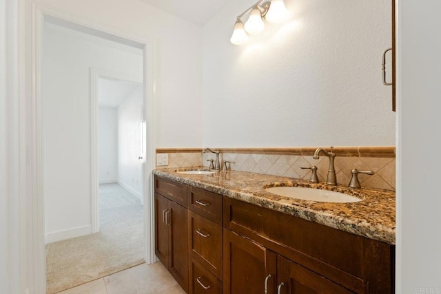 bathroom featuring a sink, tile patterned floors, and double vanity