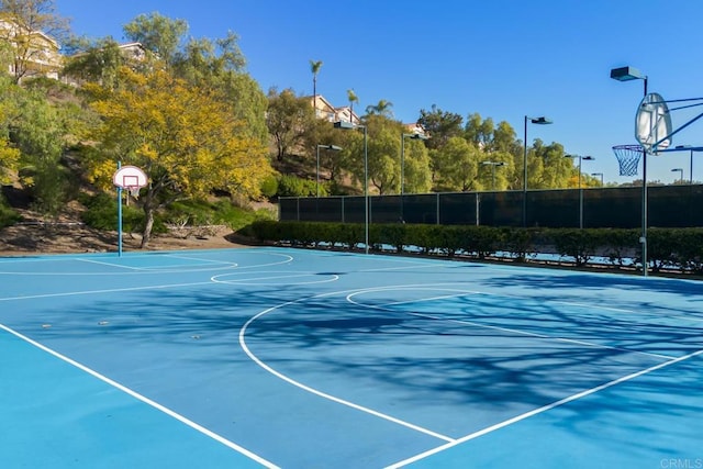 view of sport court featuring fence and community basketball court