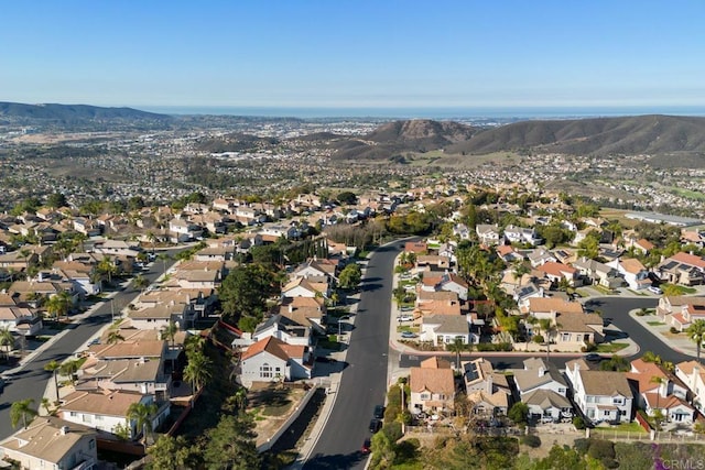birds eye view of property with a residential view and a mountain view