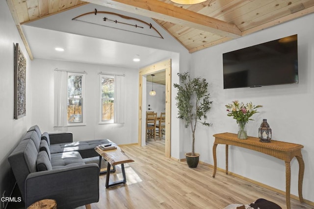 living room with lofted ceiling with beams, light hardwood / wood-style flooring, and wooden ceiling