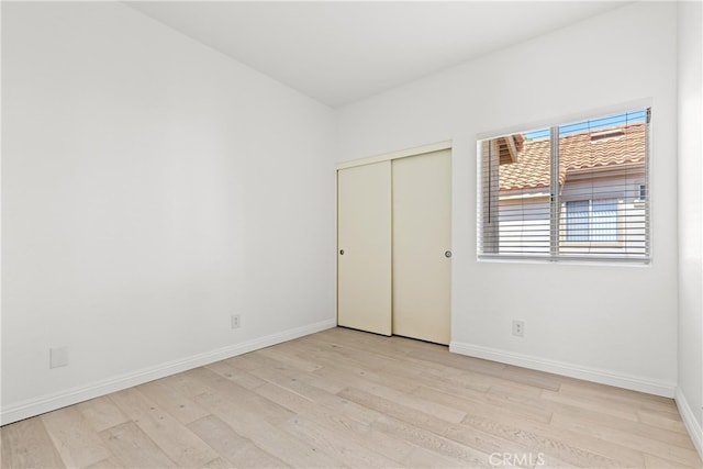 6 Daytona Dr Unit 128, Laguna Niguel, CA 92677 - unfurnished bedroom with wood finished floors and a closet