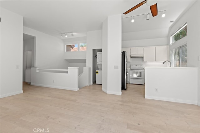 6 Daytona Dr Unit 128, Laguna Niguel, CA 92677 - unfurnished living room with track lighting, ceiling fan, light wood-style flooring, and healthy amount of natural light