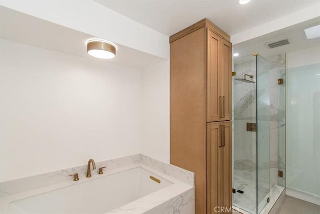 full bath featuring a marble finish shower, a garden tub, and visible vents