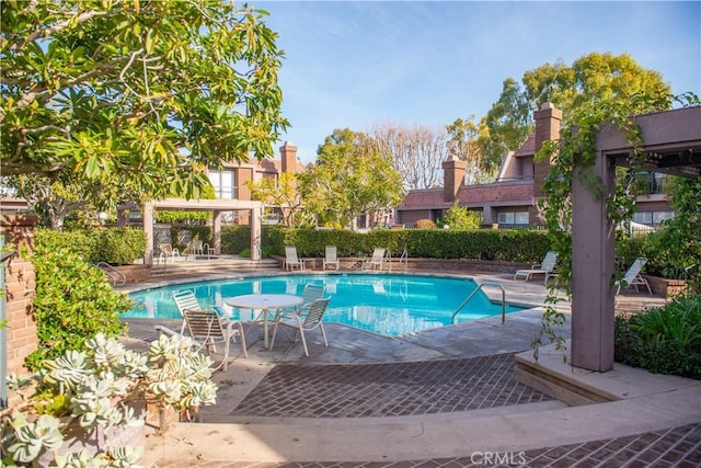 pool with a patio area