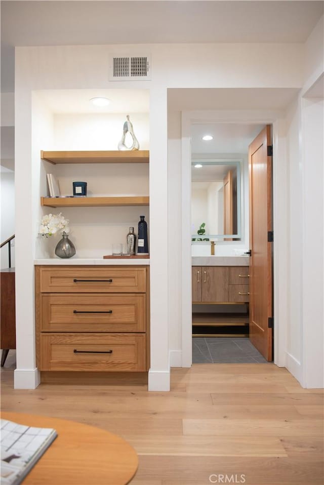 interior space with visible vents and light wood-style flooring