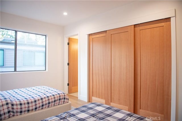 bedroom featuring a closet and recessed lighting