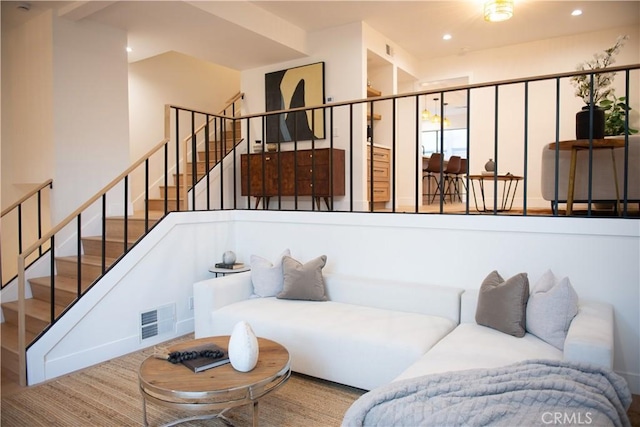 living area with stairway, recessed lighting, and visible vents
