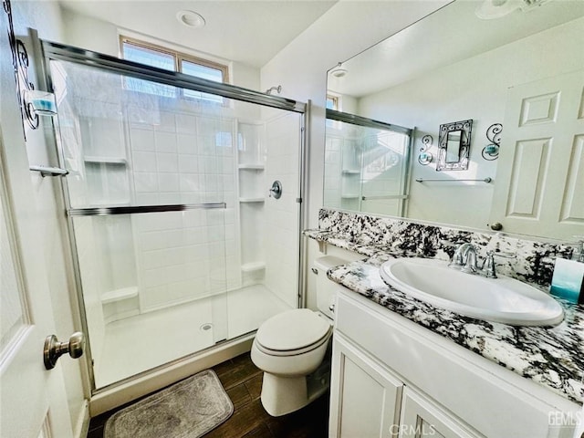 826 Jacob Creek Dr, Bakersfield, CA 93314 - bathroom featuring vanity, hardwood / wood-style floors, an enclosed shower, and toilet