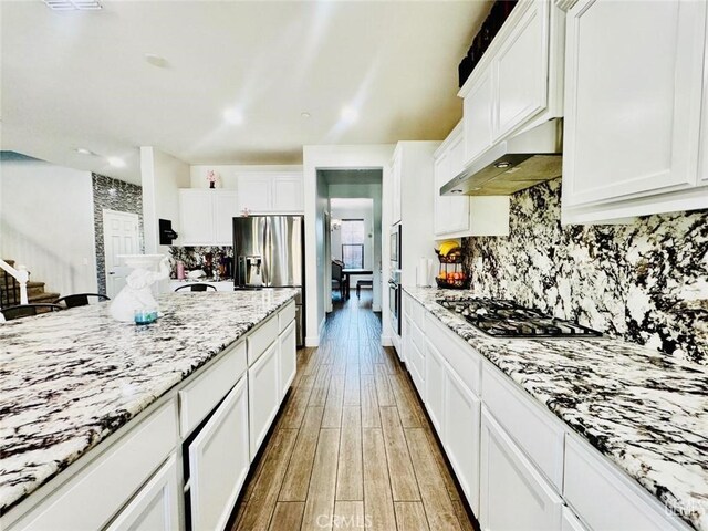826 Jacob Creek Dr, Bakersfield, CA 93314 - kitchen featuring tasteful backsplash, white cabinets, and appliances with stainless steel finishes