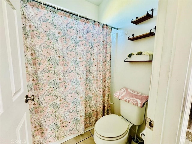 826 Jacob Creek Dr, Bakersfield, CA 93314 - bathroom with tile patterned floors, toilet, and a shower with shower curtain