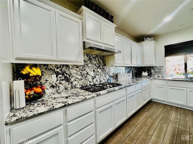 826 Jacob Creek Dr, Bakersfield, CA 93314 - kitchen featuring dark wood-type flooring, gas stovetop, light stone counters, white cabinets, and backsplash