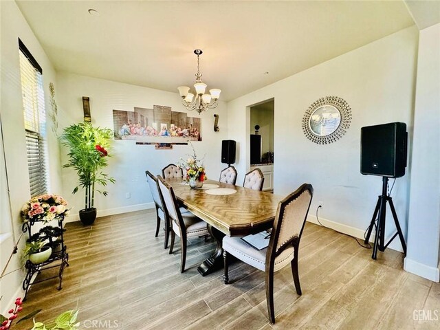 826 Jacob Creek Dr, Bakersfield, CA 93314 - dining room featuring hardwood / wood-style floors and an inviting chandelier