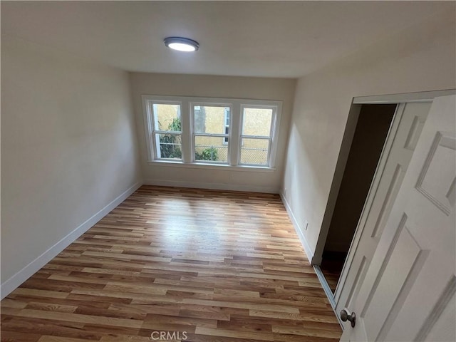 spare room with light wood-type flooring