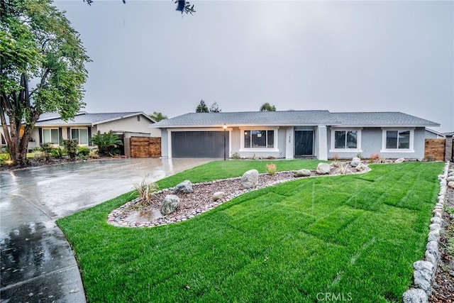 single story home featuring a front yard and a garage