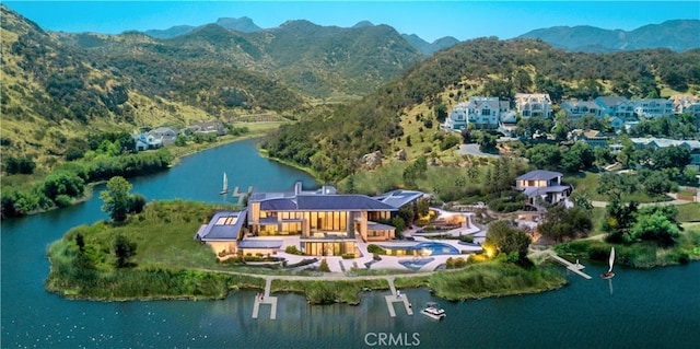 bird's eye view featuring a water and mountain view