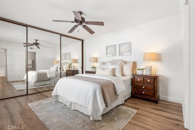 16 Wayfarer, Irvine, CA 92614 - bedroom featuring a closet, light wood-type flooring, ceiling fan, and ornamental molding