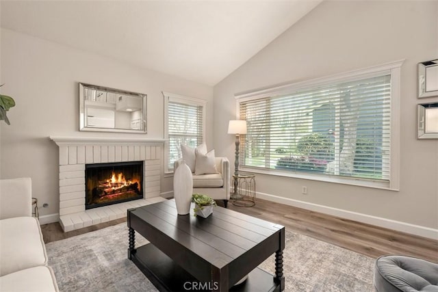 16 Wayfarer, Irvine, CA 92614 - living area with wood finished floors, a fireplace, and vaulted ceiling