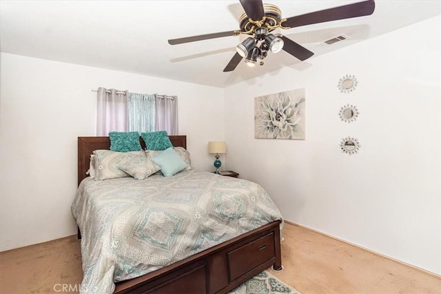 bedroom featuring light colored carpet and ceiling fan