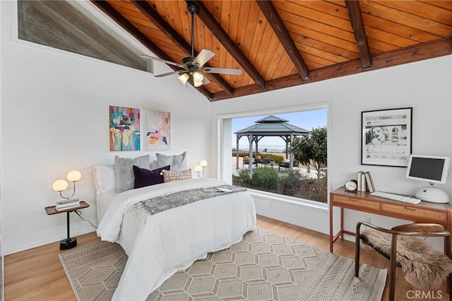 bedroom with wood ceiling, lofted ceiling with beams, and light wood-type flooring