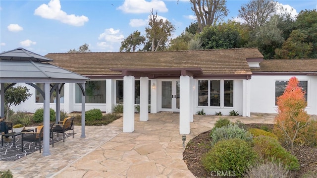 view of patio / terrace featuring a gazebo and french doors