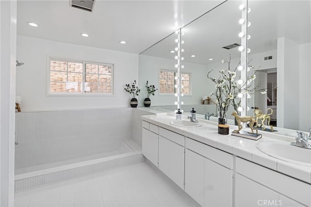 bathroom featuring tile patterned floors and vanity