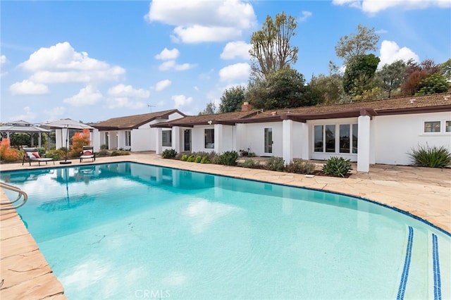 view of pool featuring a gazebo and a patio