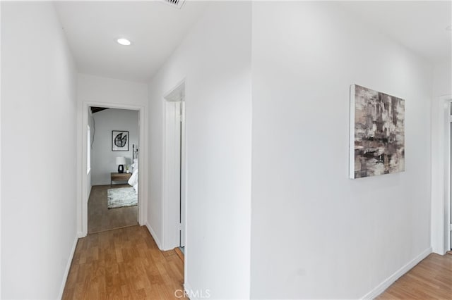 hall with light wood-type flooring
