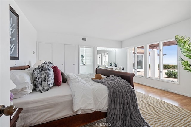 bedroom with wood-type flooring