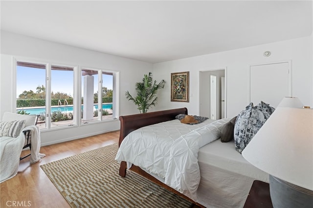 bedroom with light hardwood / wood-style floors