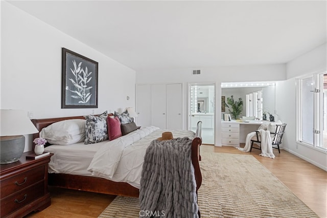 bedroom with light hardwood / wood-style floors