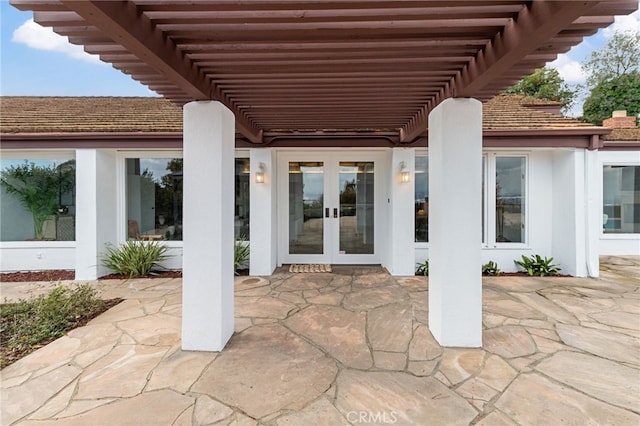 view of patio with a pergola and french doors