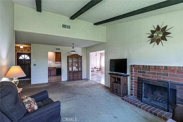 carpeted living room featuring a brick fireplace, beam ceiling, a textured ceiling, and a towering ceiling