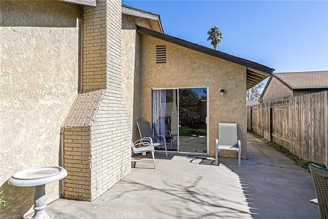 rear view of house with a patio