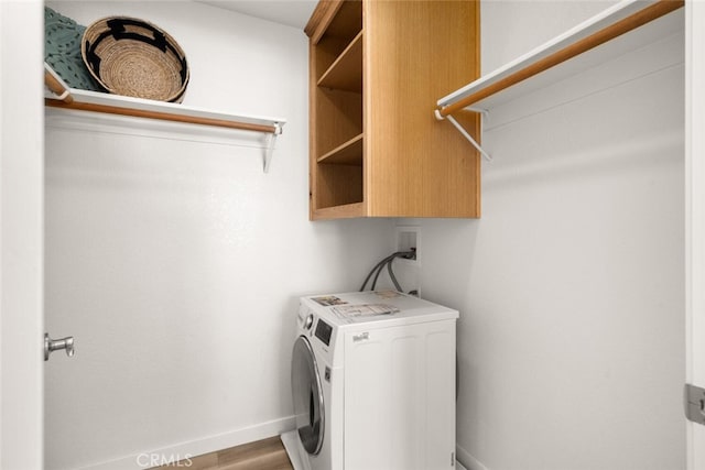 laundry room featuring washer / dryer