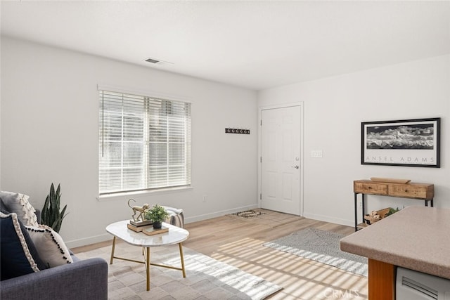 living room with light hardwood / wood-style flooring